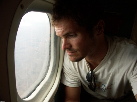 Rhett looking out plane window (Tulear)