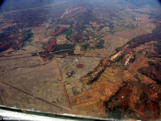 Aerial view of deforestation for rice cultivation in Madagascar (Airplane flight from Anatananarivo to Maroantsetra)