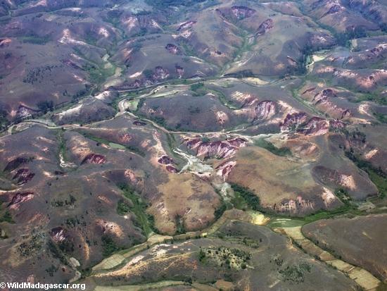 Lavaka (landslides) caused by erosion in Madagascar(Airplane flight from Anatananarivo to Maroantsetra)