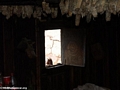 Boy peeking through the window of a Zafimaniry hut in the village of Ifasina (Ifasina / Antoetra)