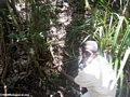 Armand examining a trap set for carnivores (Masoala NP)
